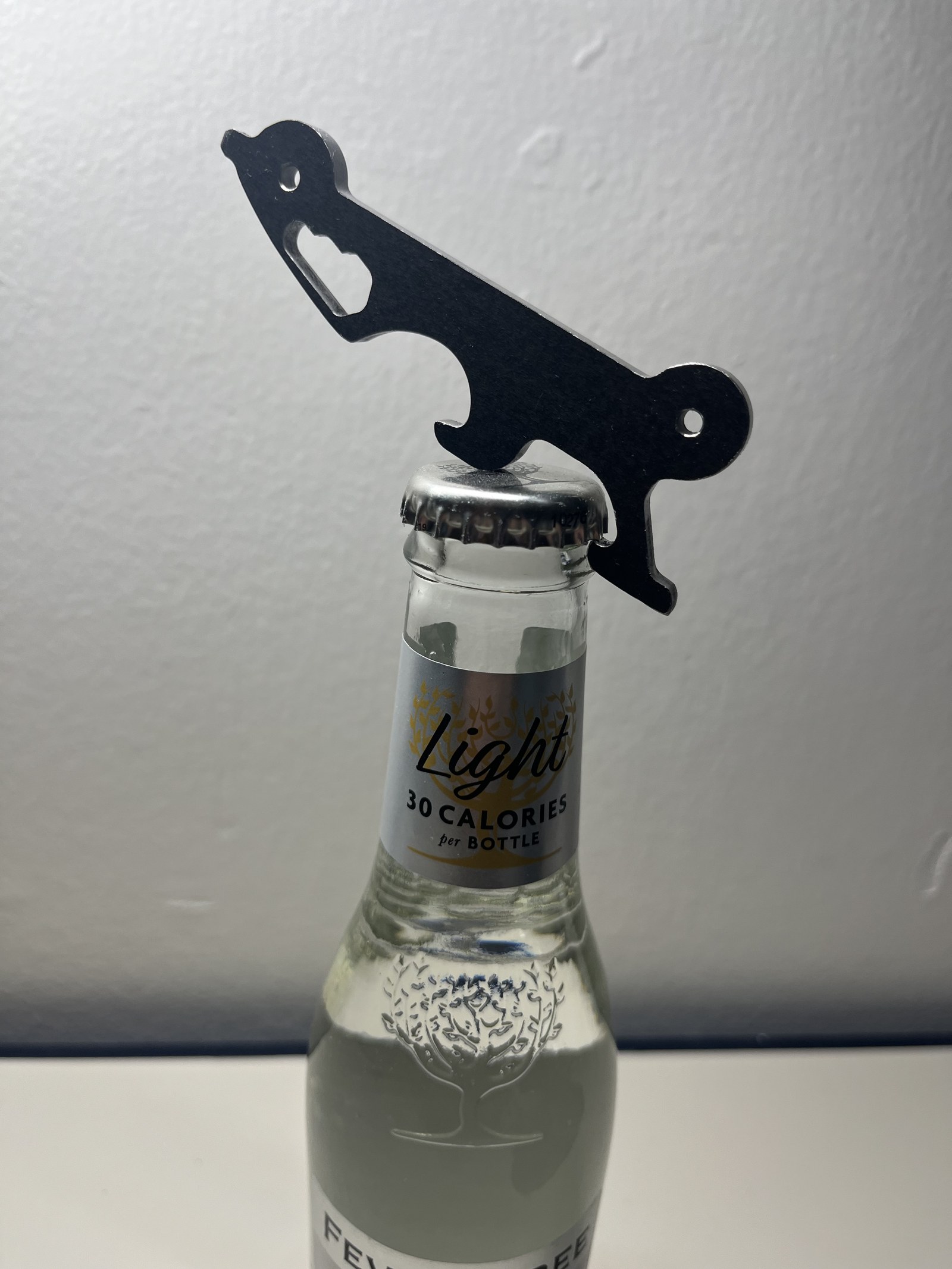 The finished tool opening a bottle